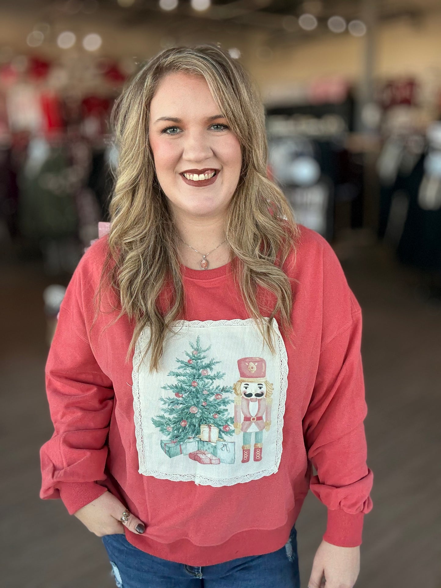 Coral Nutcracker Tree Patch Sweater